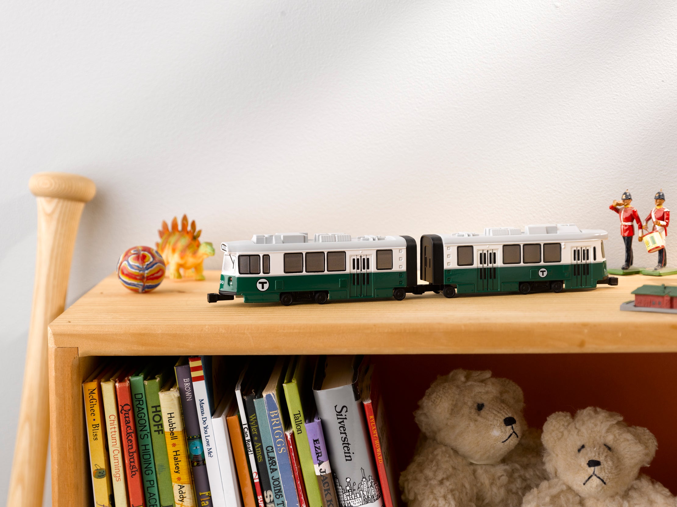 mbta mini toy trolley on child's bookshelf