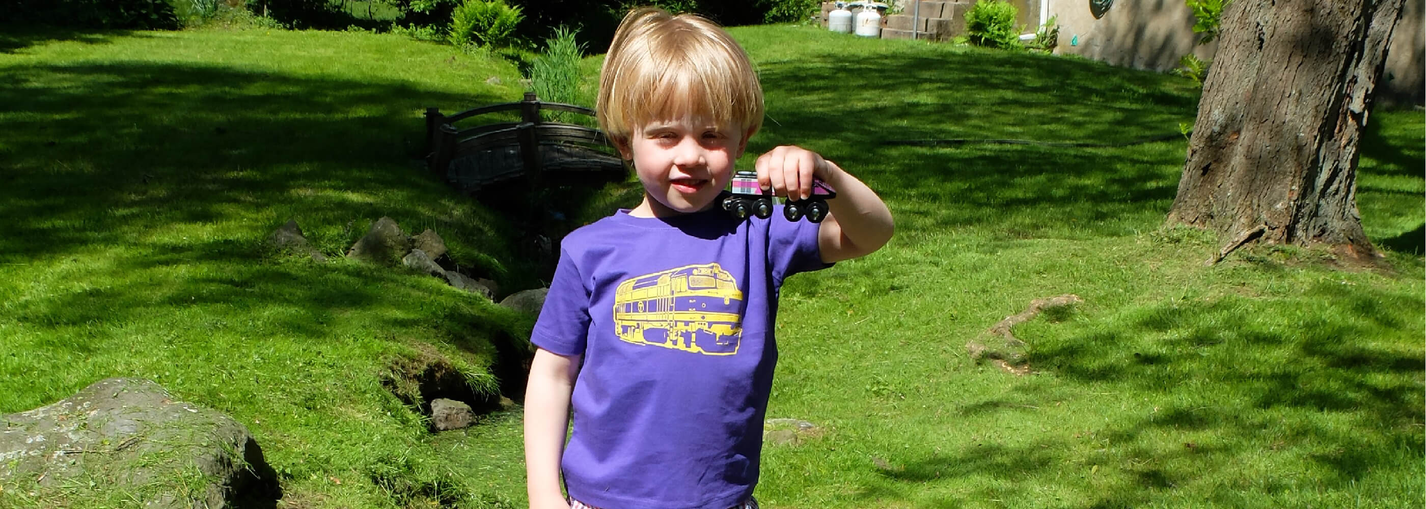 Toddler boy wearing purple Boston Commuter Rail Train T-Shirt