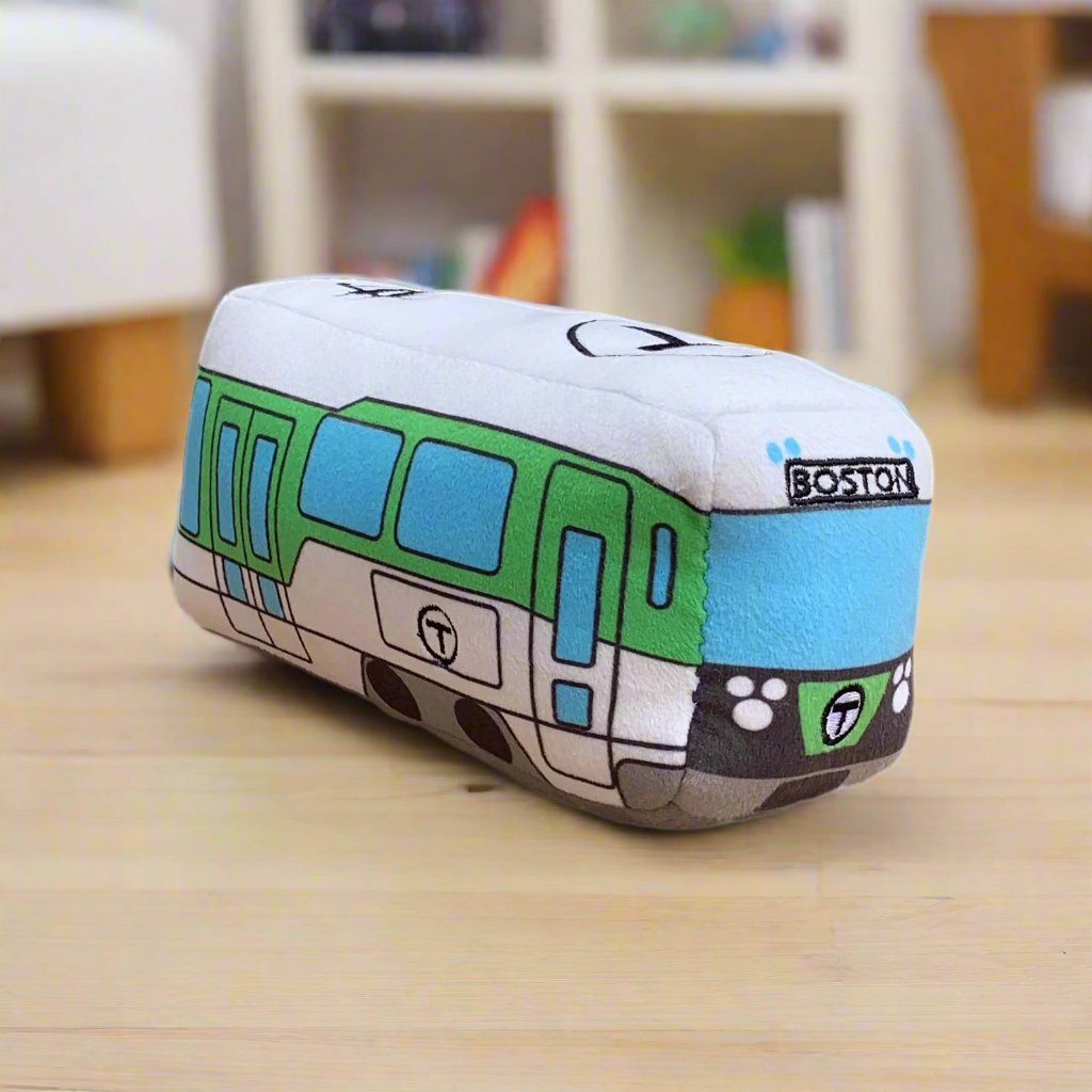 mbta mini toy trolley on child's bookshelf