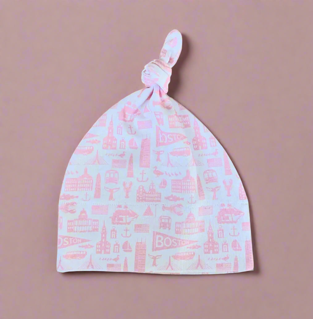 white knit newborn baby hat with pink boston massachusetts landmark pattern