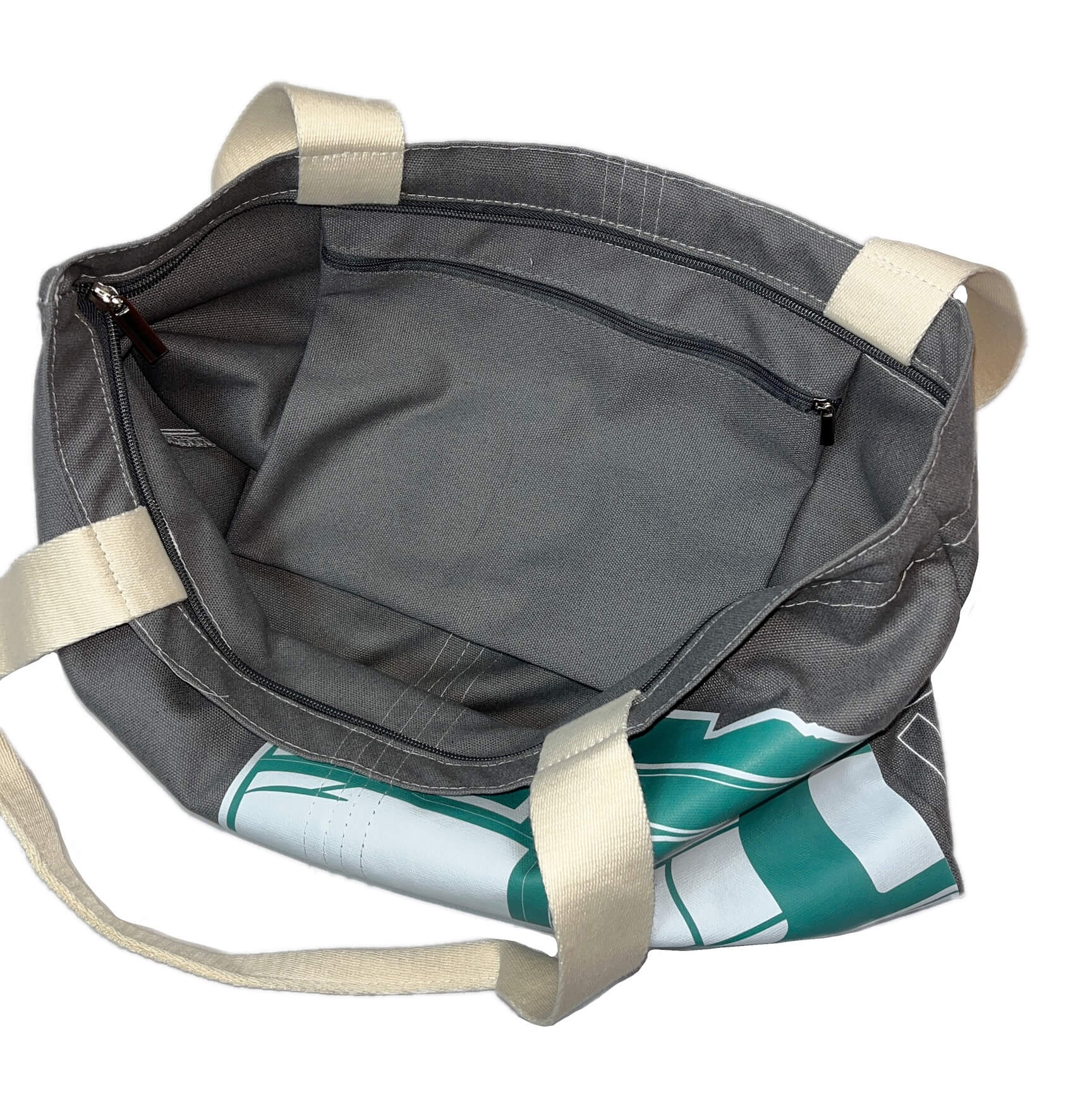 Charcoal grey canvas tote bag with large green and white Boston MBTA Green Line Trolley graphic and inner zipper pocket