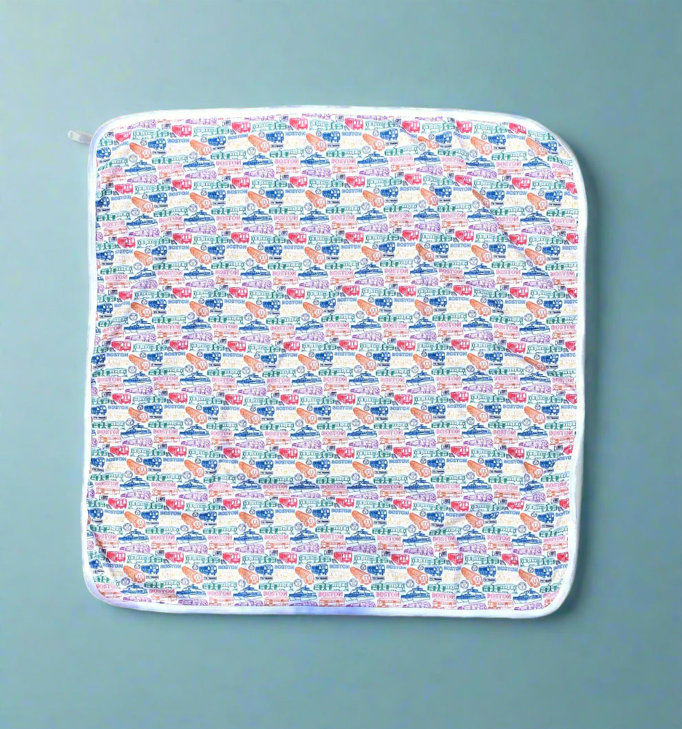 White soft cotton baby blanket with colorful Boston MBTA vehicles pattern