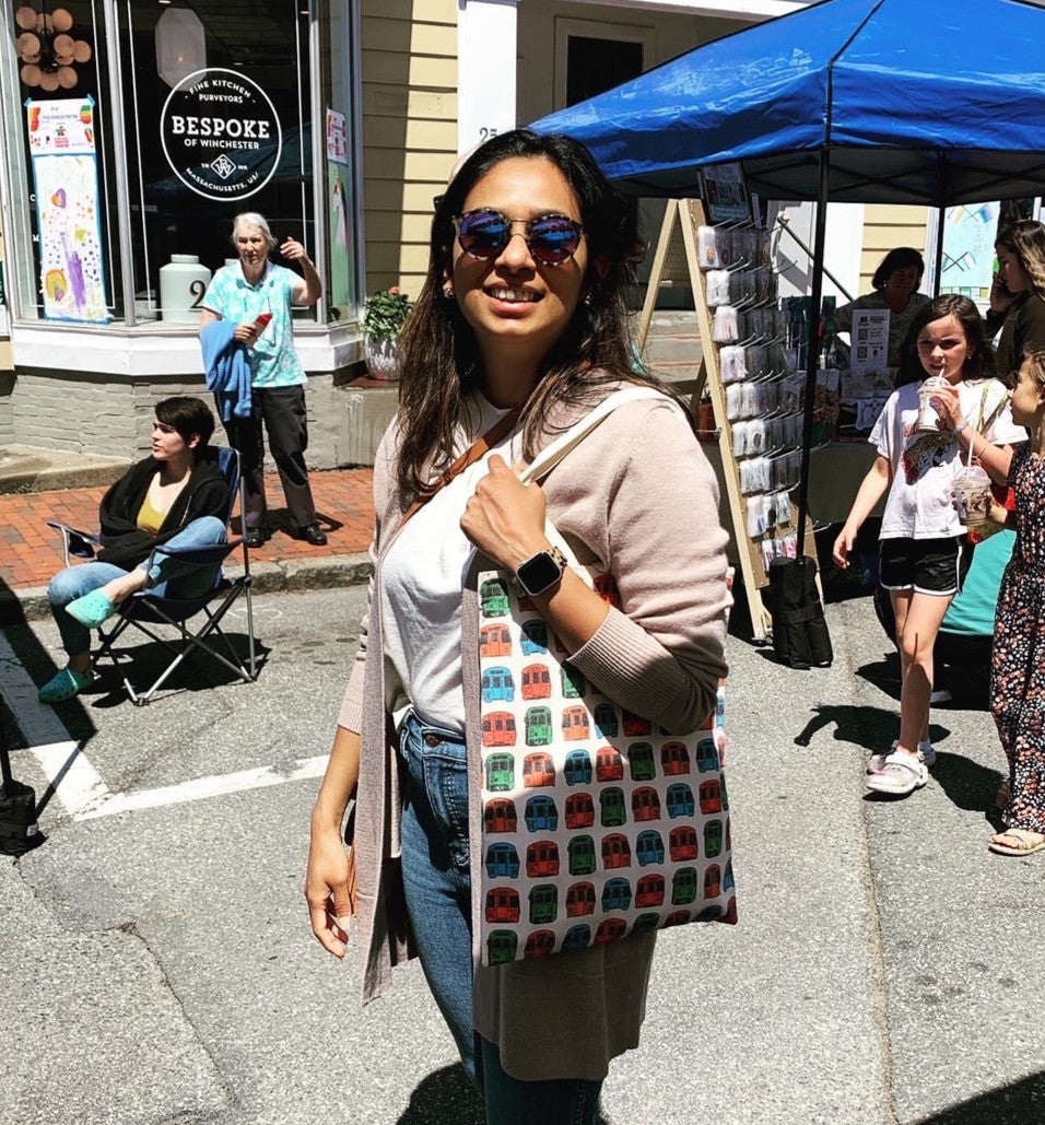 Bostonian woman with over-the-shoulder mbta subway trains pattern tote bag