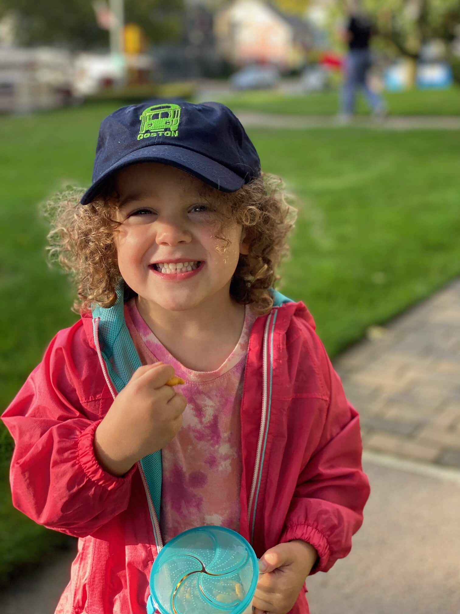 Girl wearing navy blue Boston MBTA Green Line trolley embroidered hat